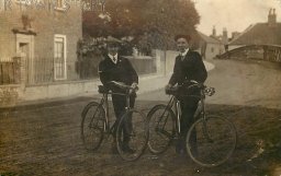 Two Dapper Cyclists Near Unknown Bridge, c. 1920s